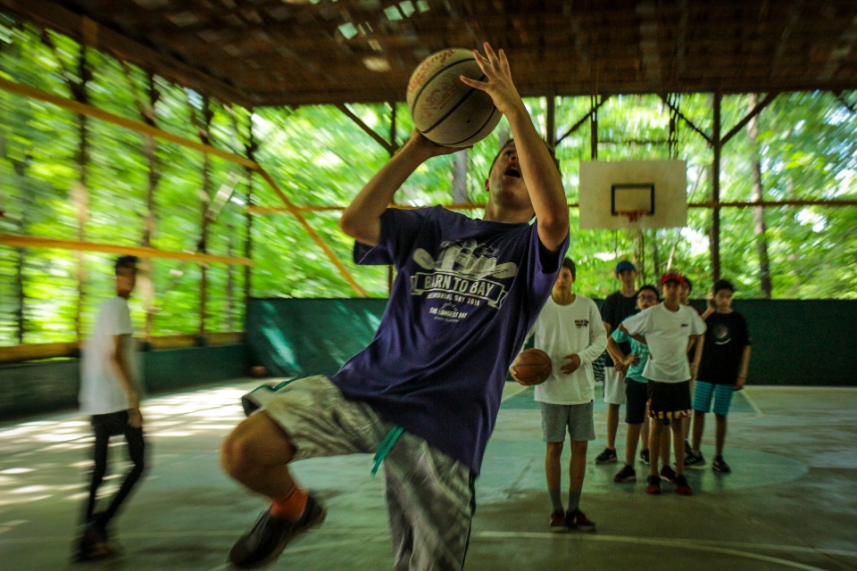 Campers playing basketball at Camp Friendship residential kids camp