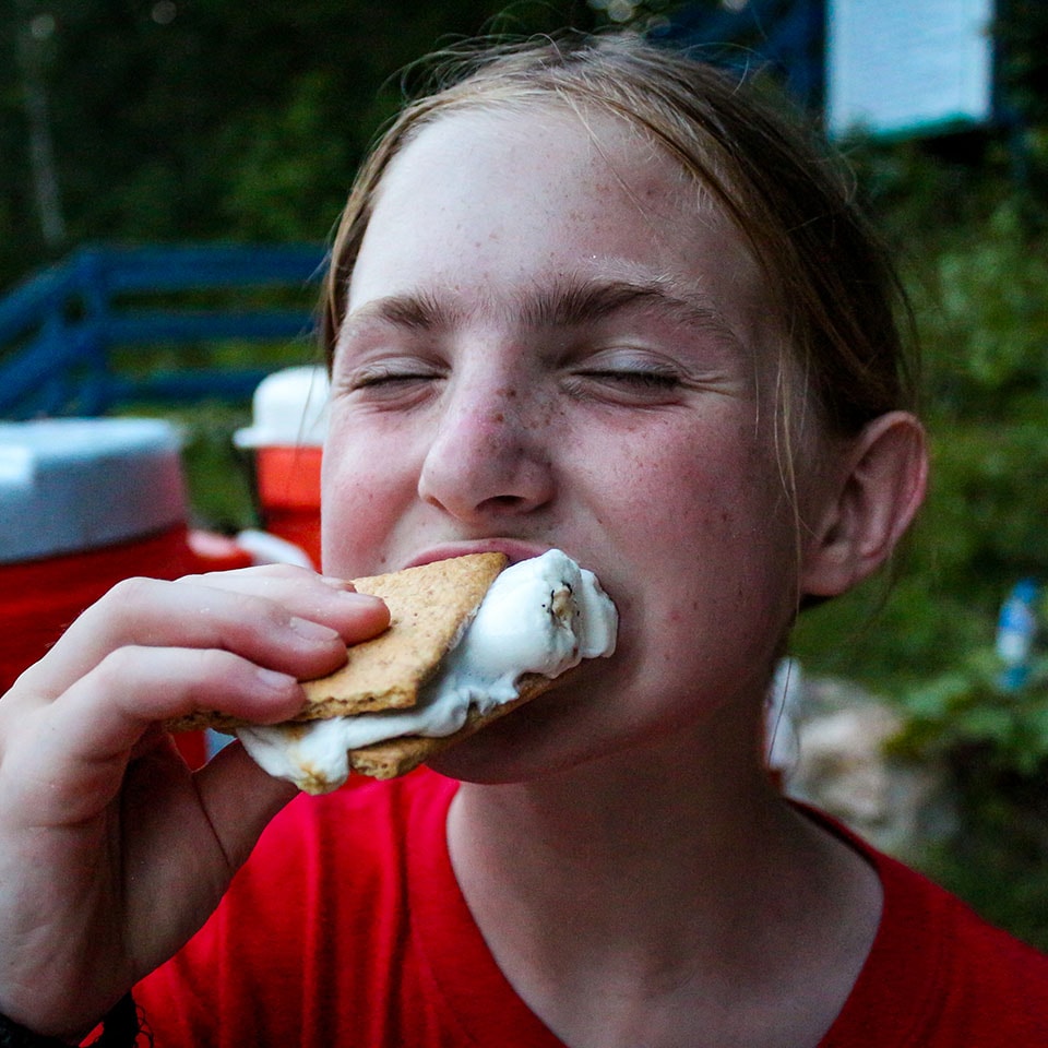 Girl Camper enjoying Smore at Camp Friendship