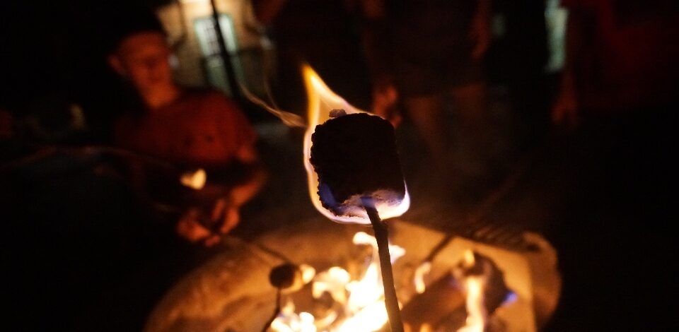 Nothing says camp dining like roasting a marshmallow by one of our fire pits, such as this one, located in every village.