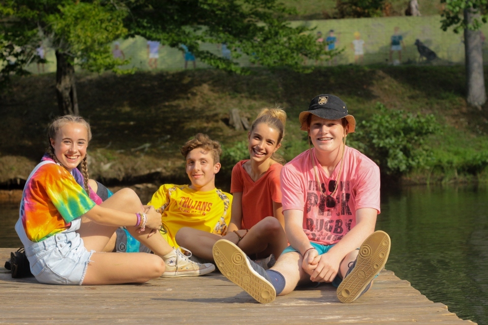 Teens enjoy the floating dock at a coed residential camp in Virginia