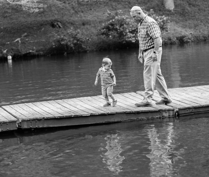 Two family members walk along the floating dock at Friendship Lake in Virginia 