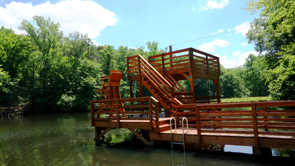 Our dive tower on camp friendship lake.  Including a zip line, diving board, and high dive for our campers to use.