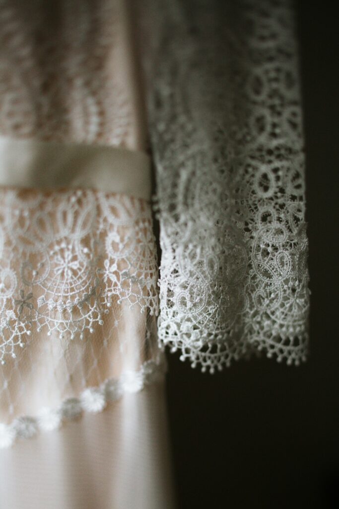 A close up of some of the lace on a wedding dress worn at camp.