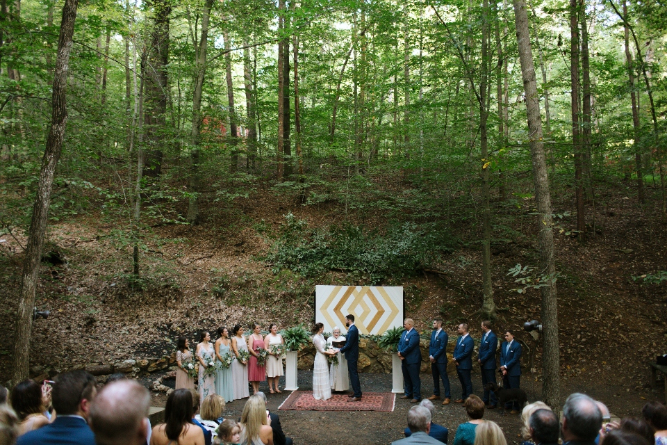 Virginia wedding ceremony in woods with Bride and Groom at center surrounded by Bridesmaids and Groomsmen
