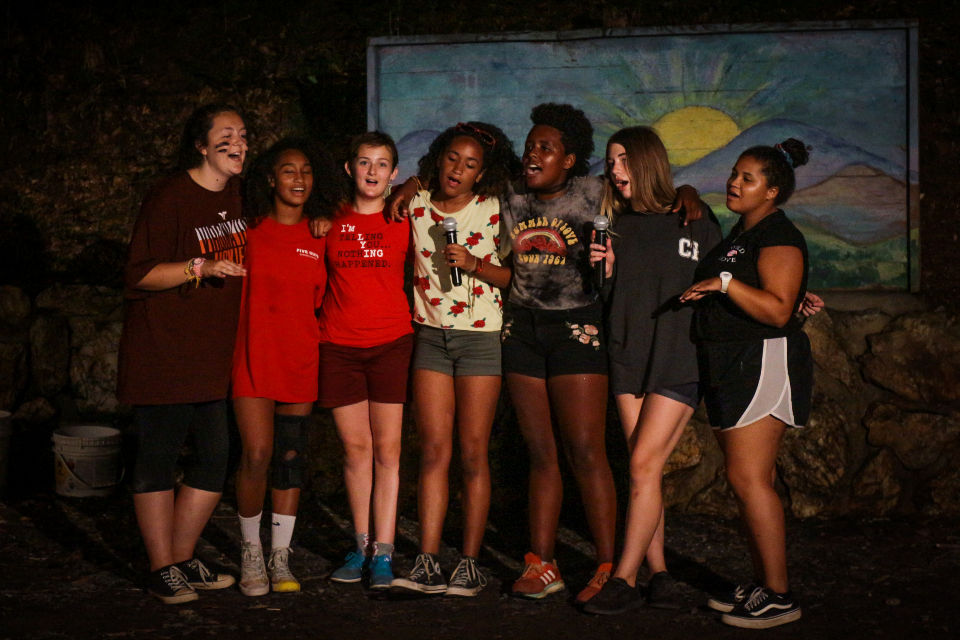 Campers and Counselors sing at summer camp residential camp