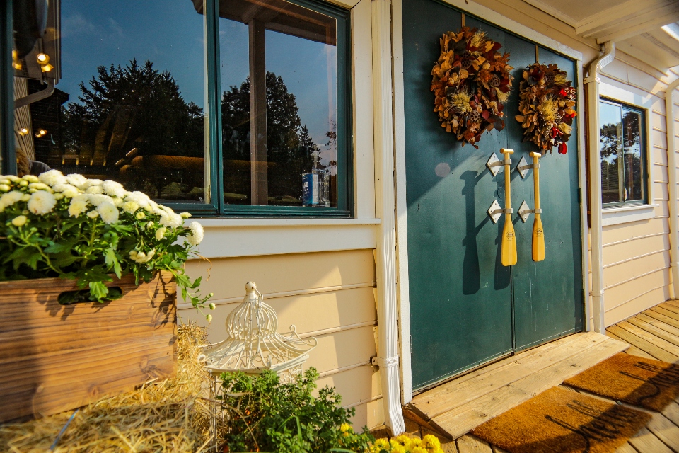 The front doors of our dining hall, decorated with local flowers and canoe paddles. 