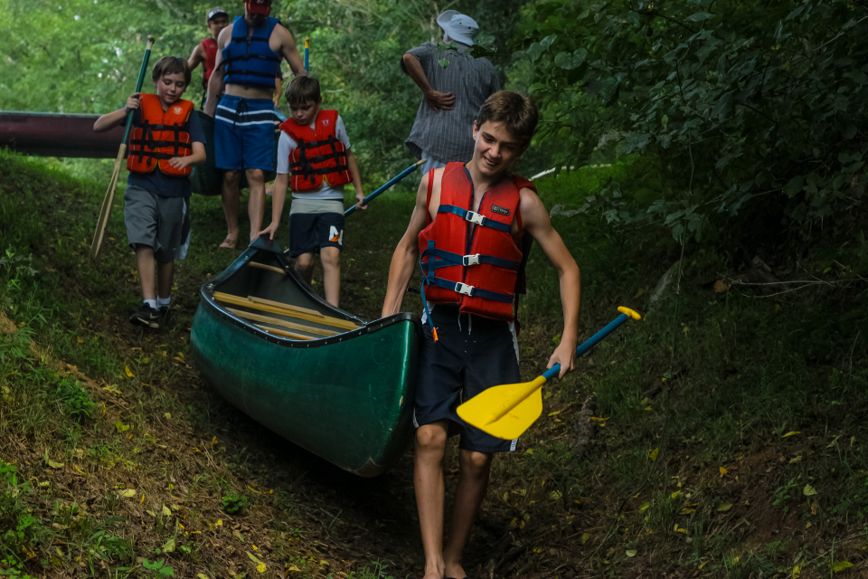 Campers and Staff preparing for canoe trip on Rivanna River at camp in Virginia 