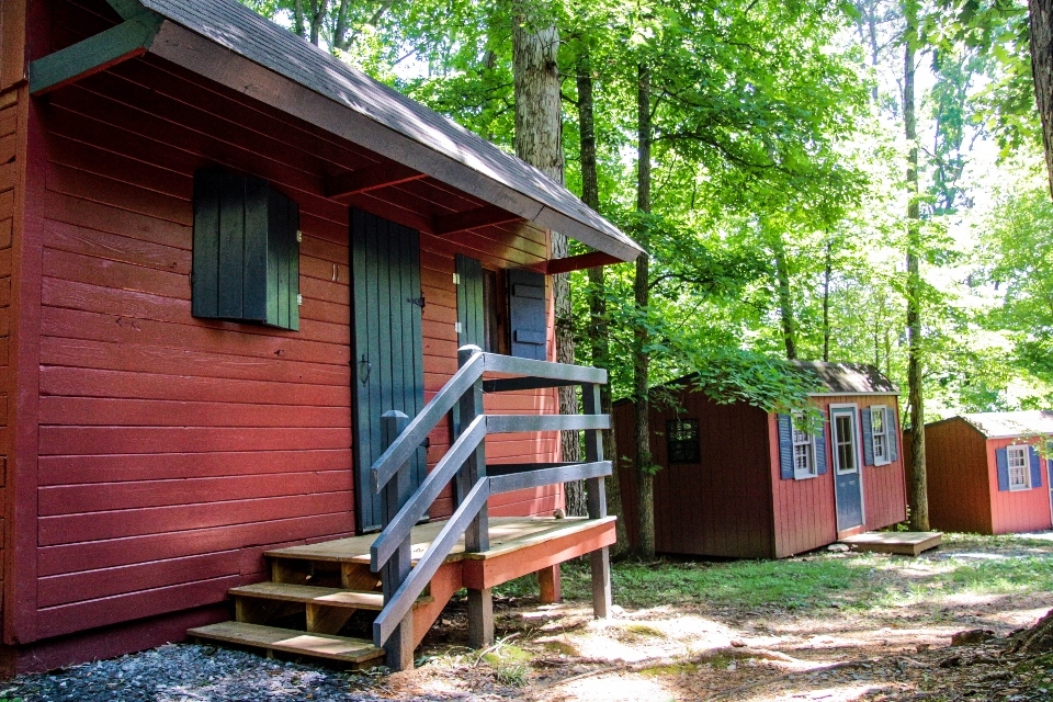 Red cabins with blue doors and trim 