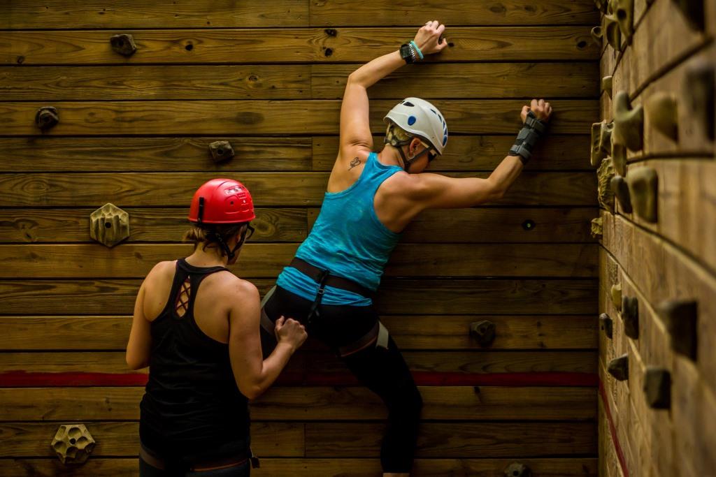 Woman climbing on bouldering wall